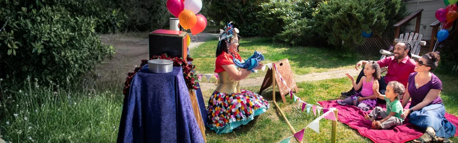 A Happily Ever Laughter faerie entertaining children at an outdoor birthday party