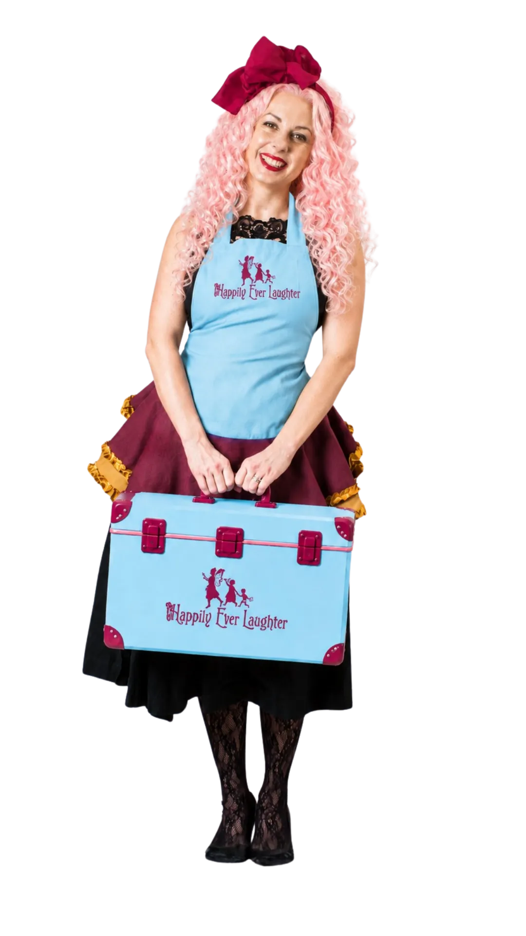 A Happily Ever Laughter party faerie with pink hair, smiling in a branded blue apron while holding a Happily Ever Laughter gift box.