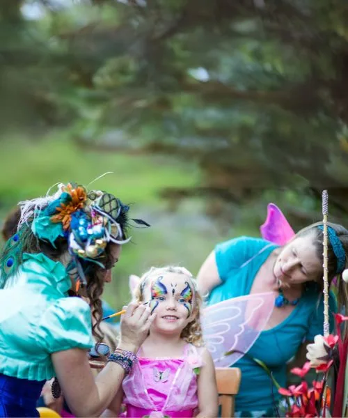 A child with festival-style face painting