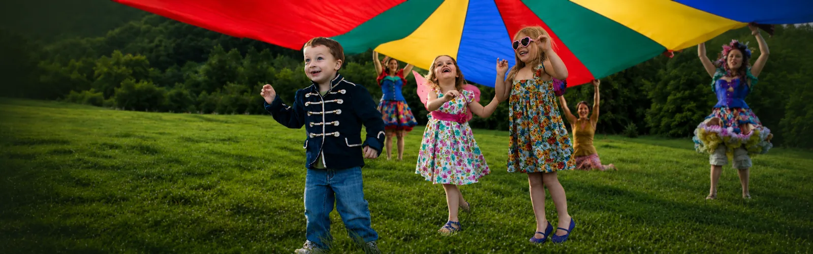 A Happily Ever Laughter performer leading a high-energy movement game with children.