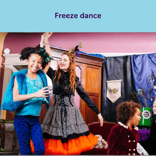 A performer and children playing an energetic freeze dance game indoors, a lively activity perfect for a rainy day party.